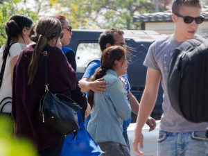 Confused and grieving family members gathered for support and information updates