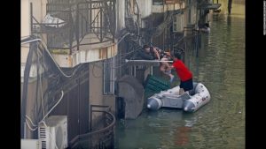 People trying to help one another as terrific flooding continues in northern China's Hubei province due to severe storms and a terrible typhoon that swept through most of the country last week.