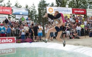 In this Olympic like timed sport, men sling their wives over their shoulders and race through a demanding and perilous obstacle course. The North American Championships are held every August in Maine and the winner receives five times his wife's weight in cash, his wife's weight in beer, and automatic entry into the World Wife Carrying Championships in Finland where the sport originated in 1991.