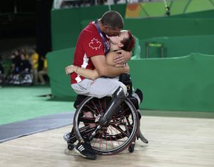 Canadian wheelchair basketball team member, Adam lancia, celebrates his wife's women's wheelchair basketball team victory over China at the Paralympic Games in Rio last week.