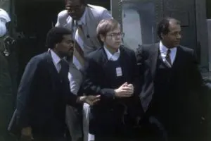 Hinckley, Jr. being apprehended and led away from the scene of the shooting on March 31, 1981.