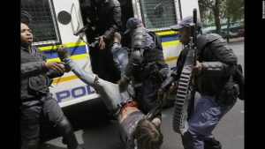 South African police, dressed as soldiers, continue to crack down on college students all over the country. The students have been protesting, for nearly a year, over recent hikes in college fees and tuitions.