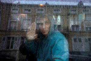 The migrant crisis continues unabated as this teenager from Afghanistan waves from a van on his way to a migrant camp somewhere in France.