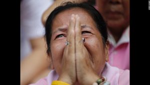 A Thai woman prays as the country of Thailand remained in mourning for King Bhumibol who died last week at the age of 88. He was the longest ruling king in Thai history.